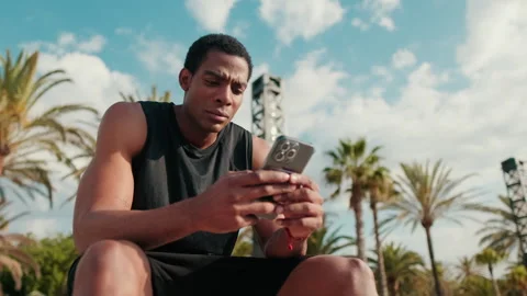 Athlete Checks Phone During Workout Break Stock Footage 313153891