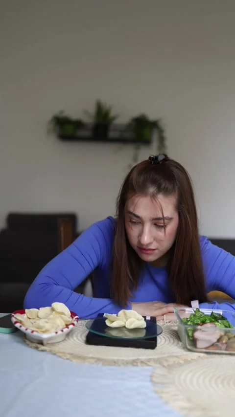 Athlete chooses between healthy food and chips Stock Footage 339854953