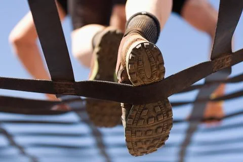 Athlete climbs the net Foto stock