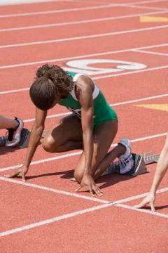 Athlete With Competitors At Starting Line Stock Photos