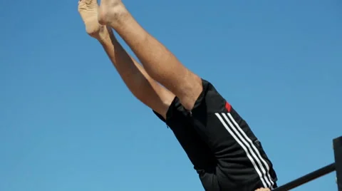Athlete Demonstrates Static Exercise on The horizontal bar. The Street workout Stock Footage 59407982