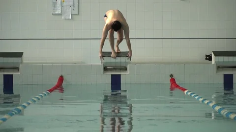 Athlete dives into the pool in slow motion Stock Footage 86282158