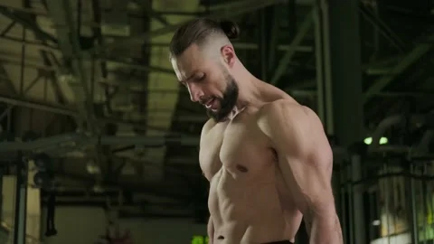 An athlete does biceps exercises with dumbbells in the gym. Sports, healthy Stock Footage 234326652