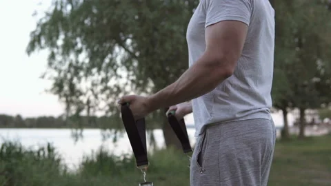 Athlete does exercises with an expander. Stock Footage 132796163