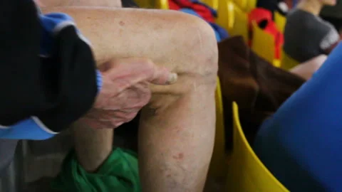 The athlete does intensive warming up massage of a back muscle of a hip. Real ti Stock Footage 85610786