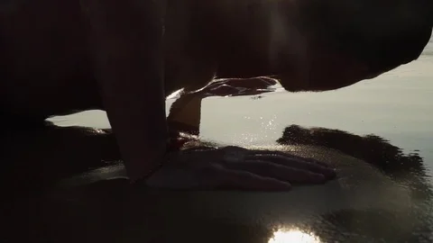 The athlete does push-ups on the beach Stockbeeldmateriaal 123049396