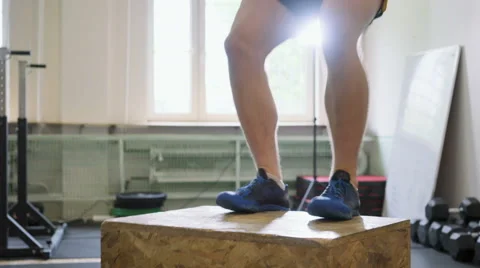 Athlete doing box jump exercise at gym Stock Footage 65278934