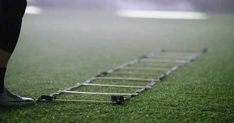 Athlete doing exercise on agility ladder in fitness studio Stock Footage 78199395