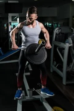 Athlete Doing Exercise for Back With Weights Stock Photos