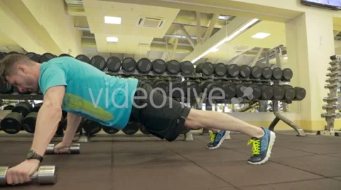 Athlete doing exercise with dumbbells Stock Footage 47861902