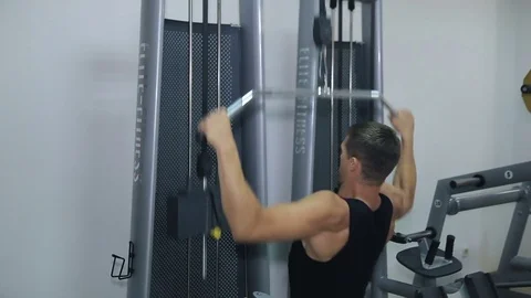 Athlete doing exercise on a simulator 스톡 동영상 71613188