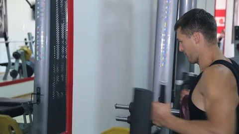 Athlete doing exercise on a simulator Stock Footage 71613189