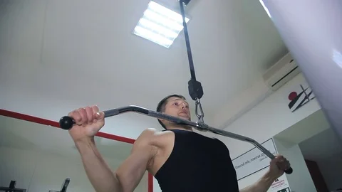 Athlete doing exercise on a simulator 스톡 동영상 71613372