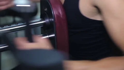 Athlete doing exercise on a simulator Stock Footage 71613436