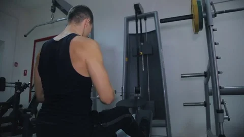 Athlete doing exercise on a simulator Stock Footage 71613592