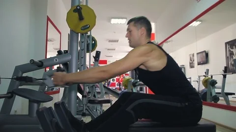 Athlete doing exercise on a simulator Stock Footage 71613741