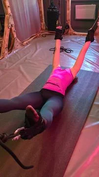 Athlete doing inverted fly exercise with suspension straps in gym Stock Photos