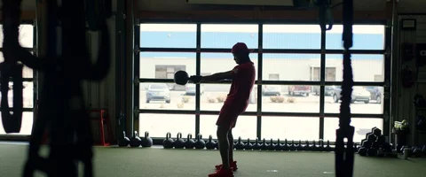 Athlete doing a kettleball workout SLOW MOTION Stock Footage 128124954