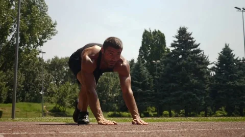 Athlete doing morning routine worm up training outdoors Stock Footage 78926213