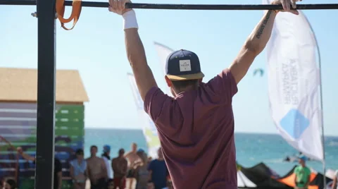 Athlete Doing Pull-ups on The Bar. The Street workout competition. Stock Footage 59422416