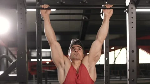 Athlete doing pull-ups at the gym. Handsome man doing functional training. Stock Footage 201405356