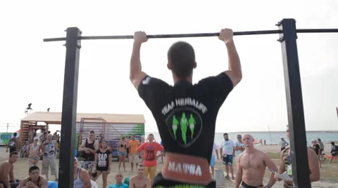 Athlete Doing Pull-ups With Weights on The horizontal bar Stock Footage 59897854
