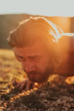 Athlete doing push-ups in the early morning. The concept of a healthy life Stock Photos