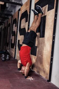 Athlete doing push-ups on his hands Stock Photos