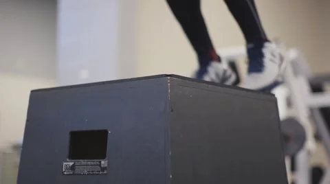 Athlete doing sets of box jumps in slow motion Stock Footage 63178473