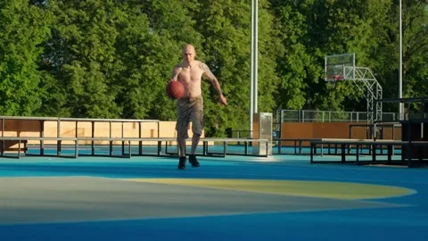 Athlete doing strength exercises on the outdoor playground on a sunny day Stock Footage 201055795