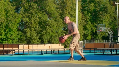 Athlete doing strength exercises on the outdoor playground on a sunny day Stock Footage 201055830