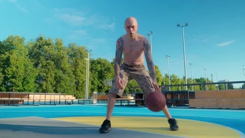 Athlete doing strength exercises on the outdoor playground on a sunny day Stock Footage 201059589