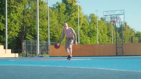 Athlete doing strength exercises on the outdoor playground on a sunny day Stock Footage 201060095