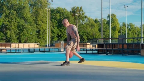 Athlete doing strength exercises on the outdoor playground on a sunny day Stock Footage 201061765