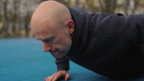 Athlete is doing workout. Sportsman is doing push ups. Video stock 239321904