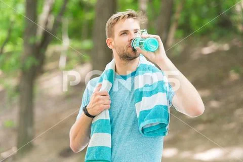 Athlete drink water. Water balance. Athlete hold bottle care hydration body Stock Photos