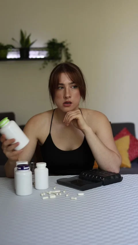 Athlete evaluates different dietary supplements. Stock Footage 339096167
