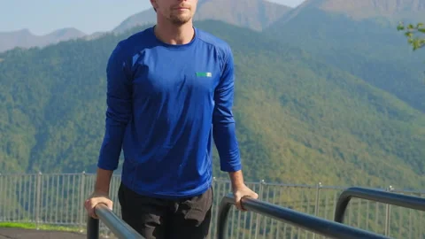 Athlete exercising on parallel bars Stock Footage 149998798