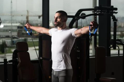 Athlete Exercising Shoulders With Pull Rope Elastic Cable Stock Photos