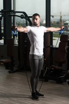 Athlete Exercising Shoulders With Pull Rope Elastic Cable Stock Photos