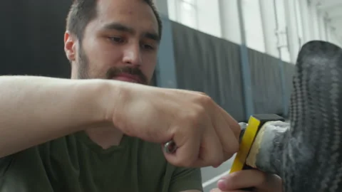Athlete Fixing Prosthesis with Wrench Stock Footage 202014845