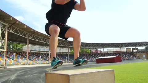 Athlete gave exercise. Jumping on the box. Stock Footage 130802151