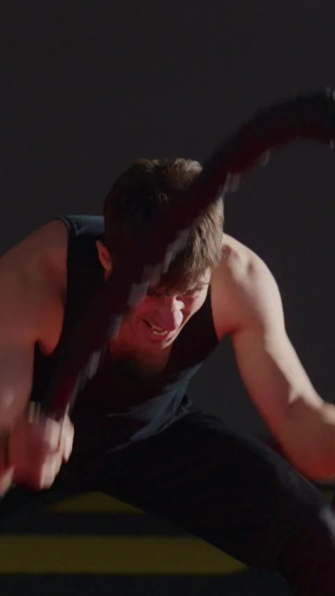 Athlete grunts with effort while battling ropes Stock Footage 335506212
