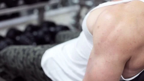Athlete in the gym doing bicep exercises Stock Footage 84011165