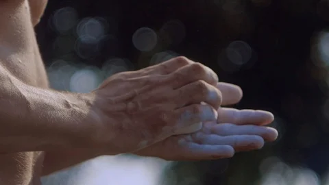 Athlete hands clapping with white chalk powder that explodes in slow motion Stock Footage 100201532