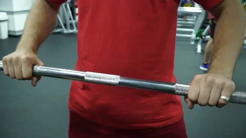 The athlete with his hands scrolls the bar of the bar Stock Footage 92124280