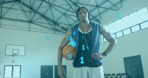 Athlete holding basketball while camera zooming in, revealing binary code Stock Footage 317592247