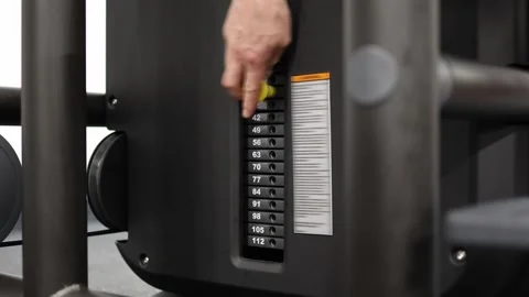 Athlete increases weight during strength training Stock Footage 337346685