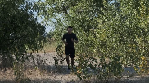 Athlete jogging in the park Stock Footage 111630076