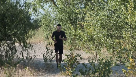 Athlete jogging in the park Stock Footage 111630085